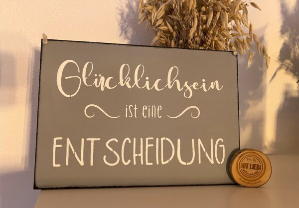 Spruchschild Glücklichsein ist eine Entscheidung